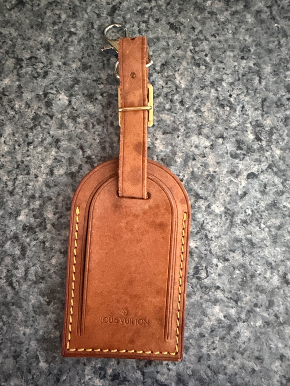 Genuine leather pre-loved Louis Vuitton luggage tag with water marks